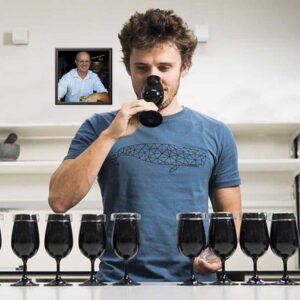 Lukas tasting from a glass during a tasting session