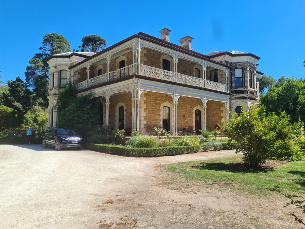 Historic limestone homestead surrounded by established gardens