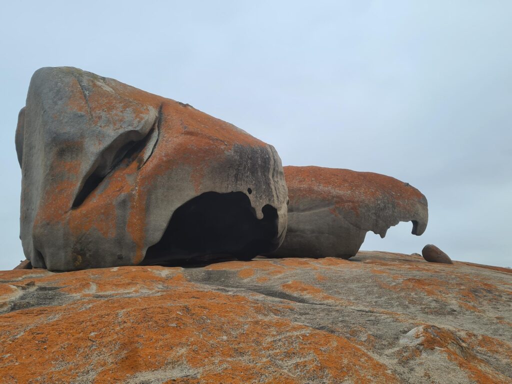 Remarkable Rocks on Kangaroo Island, weathered granite boulders covered in orange lichen